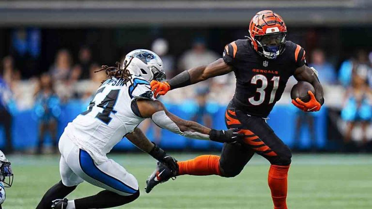 Cincinnati Bengals running back Zack Moss runs past Carolina Panthers linebacker Shaq Thompson during the second half of an NFL football game, Sunday, Sept. 29, 2024, in Charlotte, N.C. (Rusty Jones/AP)