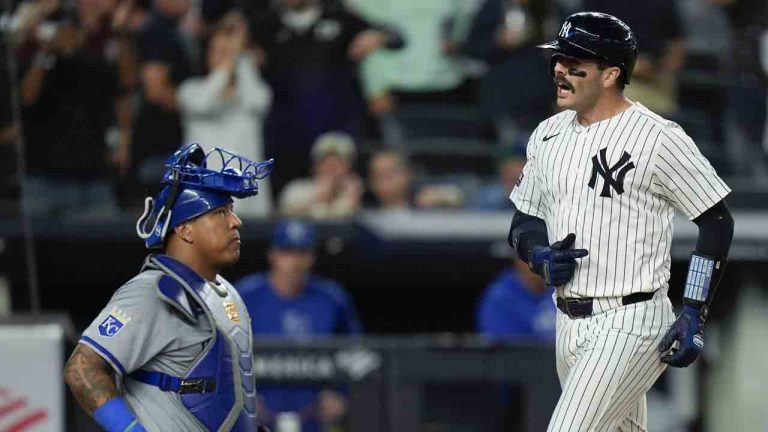 Kansas City Royals catcher Salvador Perez, left, looks on as New York Yankees' Austin Wells, right, crosses home plate after hitting a three-run home run during the seventh inning of a baseball game at Yankee Stadium, Monday, Sept. 9, 2024, in New York. (Seth Wenig/AP)