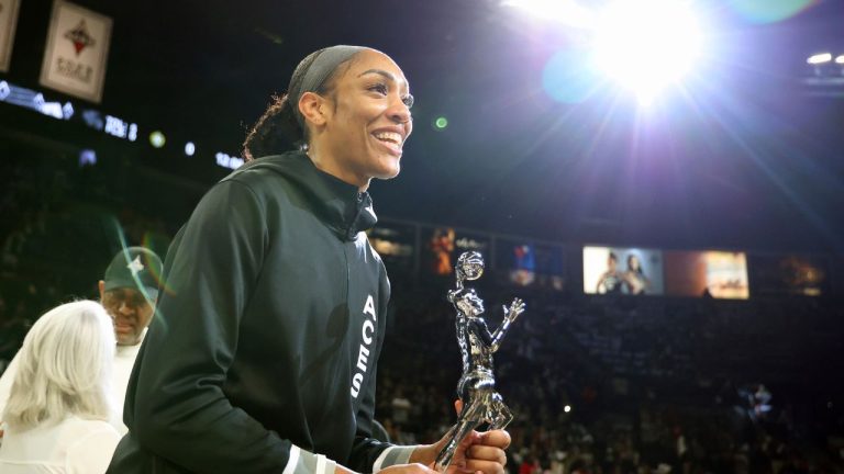 Las Vegas Aces centre A'ja Wilson (22) receives the 2024 WNBA MVP award prior to playing in a first-round WNBA basketball playoff game against the Seattle Storm. (Ronda Churchill/AP)