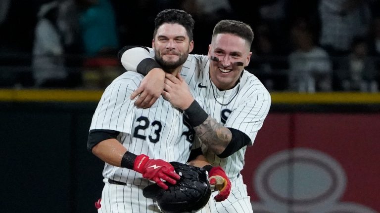 Chicago White Sox's Andrew Benintendi, left, celebrates his walk-off RBI single with catcher Korey Lee, right, against the Los Angeles Angels during the tenth inning of a baseball game, Wednesday, Sept. 25, 2024, in Chicago. (David Banks/AP)