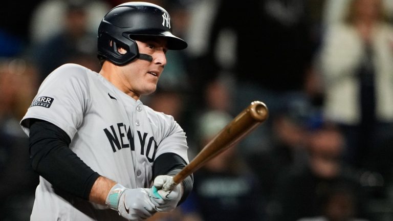 New York Yankees' Anthony Rizzo follows through on an RBI double against the Seattle Mariners during the 10th inning of a baseball game Wednesday, Sept. 18, 2024, in Seattle. (AP Photo/Lindsey Wasson)