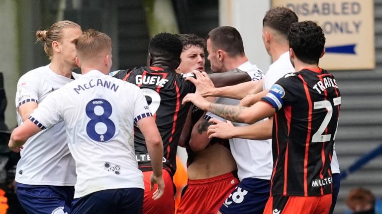 Blackburn Rovers' Owen Beck is confronted by Preston North End's Milutin Osmajic before being shown a red card, during an English Football League soccer match, at Deepdale, in Preston, England, Sunday, Sept. 22, 2024. (Nick Potts/PA via AP)