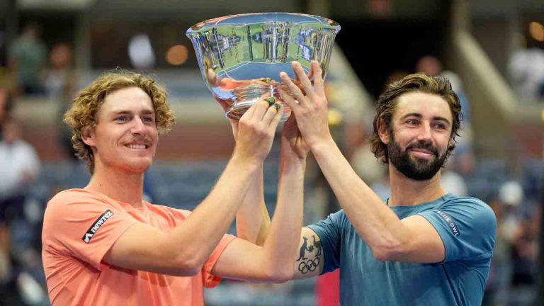 Max Purcell, left, and Jordan Thompson, of Australia, hold up the championship trophy after defeating Tim Puetz and Kevin Krawietz, of Germany in the men's doubles final of the U.S. Open tennis championships, Saturday, Sept. 7, 2024, in New York. (Pamela Smith/AP)