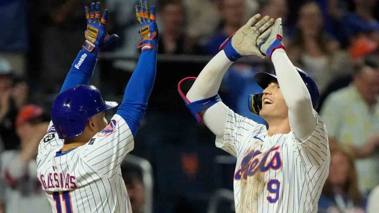 New York Mets' Jose Iglesias, left, and Brandon Nimmo, react after Nimmo hit a home run leading Iglesias and Starling Marte to score during the fourth inning of a baseball game against the Washington Nationals, Wednesday, Sept. 18, 2024, in New York. (Pamela Smith/AP)