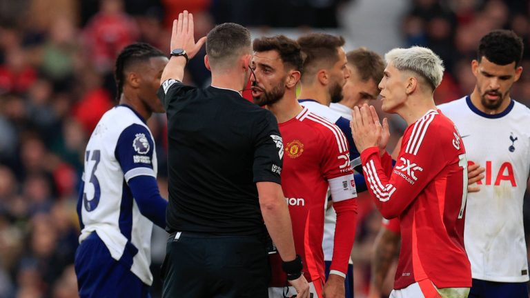 Bruno Fernandes of Manchester United contests referee Chris Kavanagh's decision to send him off during the Premier League match between Manchester United and Tottenham Hotspur at Old Trafford, Manchester, England on 29 September 2024.