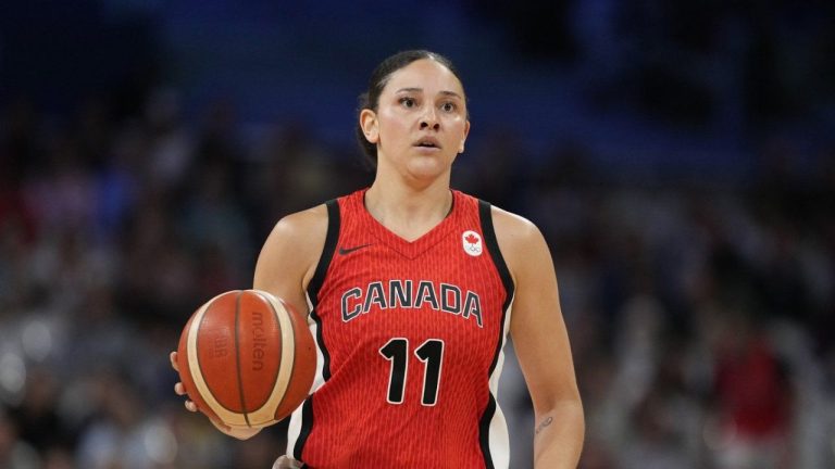 Becoming a coach has always been in the cards for Canadian basketball great Natalie Achonwa. Achonwa dribbles during a women's basketball game against Australia at the 2024 Summer Olympics, in Villeneuve-d'Ascq, France, Thursday, Aug. 1, 2024. (Michael Conroy/AP Photo)