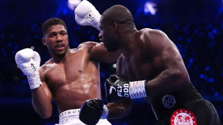Anthony Joshua, left, and Daniel Dubois fight in the IBF World Heavyweight bout at Wembley Stadium, in London, Saturday, Sept. 21, 2024. (Bradley Collyer/PA via AP)