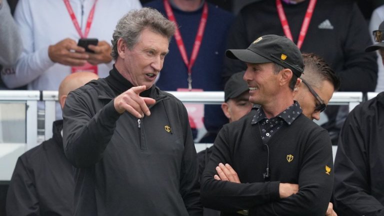 International team captain Mike Weir, right, chats with hockey legend Wayne Gretzky at the Presidents Cup golf tournament at the Royal Montreal Golf Club in Montreal, Thursday, Sept. 26, 2024. (Christinne Muschi/CP Photo)