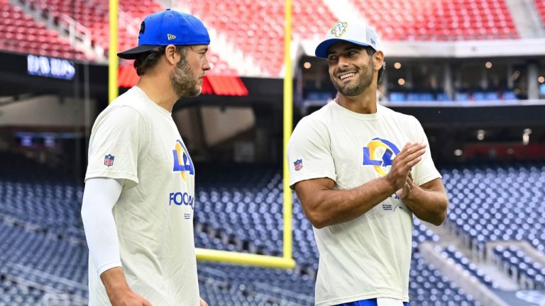 Los Angeles Rams quarterback Matthew Stafford, left, and quarterback Jimmy Garoppolo, right, walk onto the field prior to an NFL football game against the Houston Texans, Saturday, Aug 24, 2024, in Houston. (Maria Lysaker/AP Photo)