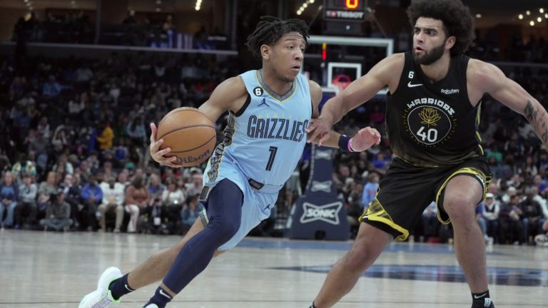 Memphis Grizzlies guard Kennedy Chandler (1) heads to the basket as Golden State Warriors forward Anthony Lamb defends in the second half of an NBA basketball game Saturday, March 18, 2023, in Memphis, Tenn. (AP Photo/Karen Pulfer Focht)