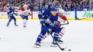 Montreal Canadiens' Jayden Struble checks Toronto Maple Leafs' Easton Cowan during second period pre-season NHL action in Toronto on Thursday, September 26, 2024. (Cole Burston/CP Photo)