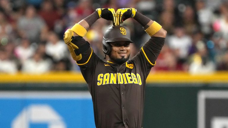 San Diego Padres' Luis Arraez reacts after hitting a double against the Arizona Diamondbacks in the first inning during a baseball game, Friday, Sept. 27, 2024, in Phoenix. (AP Photo/Rick Scuteri)