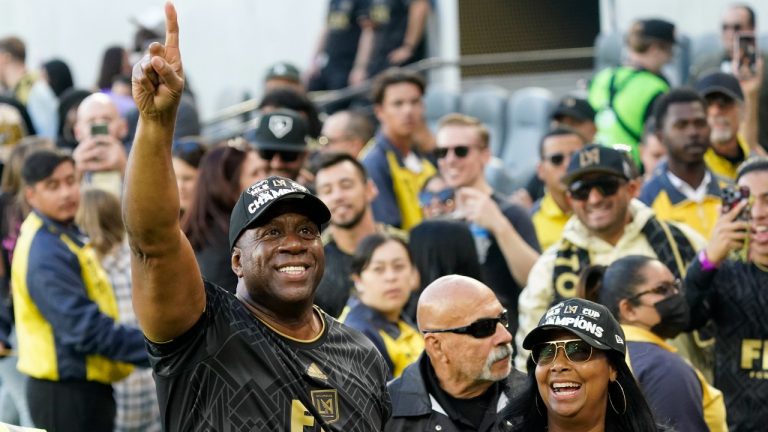 Los Angeles FC chairman and CEO Magic Johnson, left, celebrates after defeating the Philadelphia Union in a penalty kick shootout to win the MLS Cup soccer match Saturday, Nov. 5, 2022, in Los Angeles. (AP Photo/Marcio Jose Sanchez)