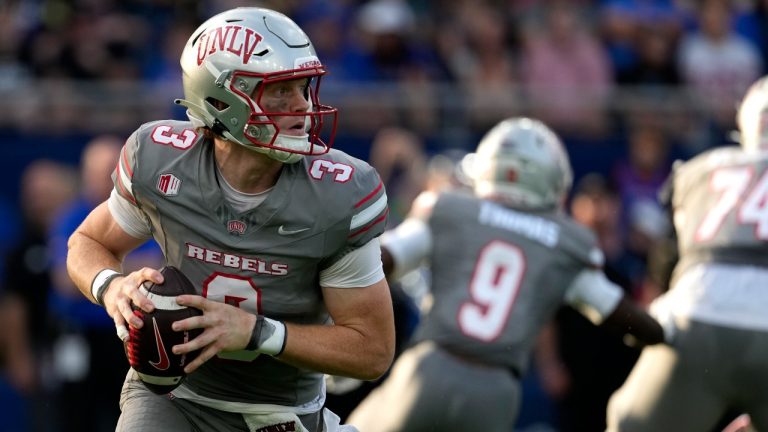 UNLV quarterback Matthew Sluka (3) looks to pass against Kansas in the first half of an NCAA college football game Friday, Sept. 13, 2024, at Children's Mercy Park in Kansas City, Kan. (AP Photo/Ed Zurga)