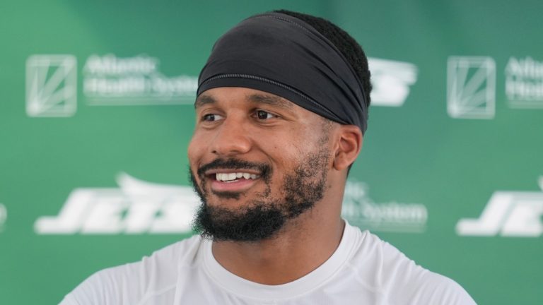 New York Jets' Michael Carter II speaks to reporters after a practice at the NFL football team's training facility in Florham Park, N.J., July 30, 2024. (AP/Seth Wenig, File)
