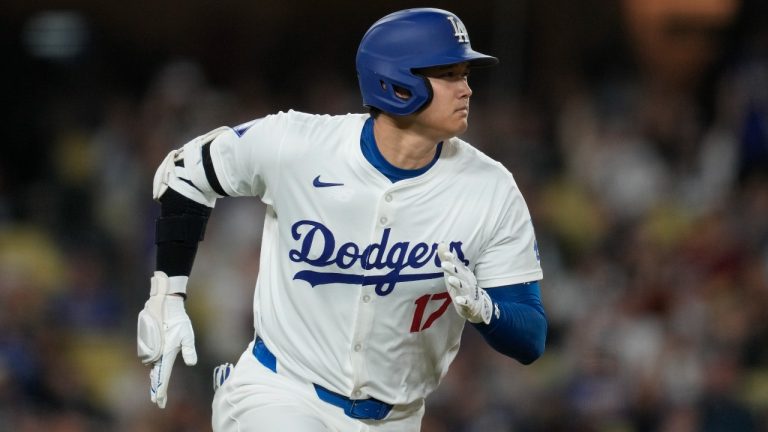 Los Angeles Dodgers designated hitter Shohei Ohtani runs on a single during the third inning of a baseball game against the Colorado Rockies in Los Angeles, Friday, Sept. 20, 2024. (AP/Ashley Landis)