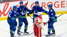DeBrusk, Sprong help Canucks rally past Flames in OT