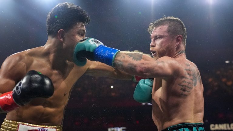 Canelo Alvarez hits Jaime Munguia in a super middleweight title fight Saturday, May 4, 2024, in Las Vegas. (John Locher/AP)
