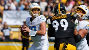 Los Angeles Chargers quarterback Justin Herbert, left, looks for an open receiver during the first half of an NFL football game against the Pittsburgh Steelers, Sunday, Sept. 22, 2024, in Pittsburgh. (Gene J. Puskar/AP Photo)