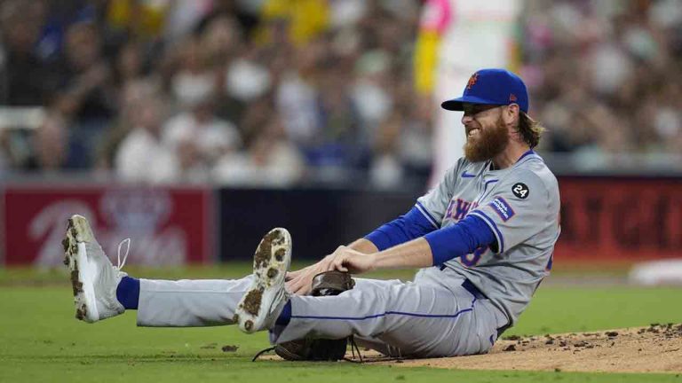 New York Mets starting pitcher Paul Blackburn stays down after getting hit by a line out by San Diego Padres' David Peralta during the third inning of a baseball game Friday, Aug. 23, 2024, in San Diego. (Gregory Bull/AP)