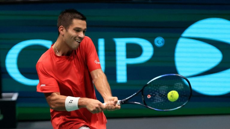 Canada's Alexis Galarneau returns the ball to Chile's Alejandro Tabilo during the men's single Davis Cup group A tennis match between Chile and Canada, in Bologna, Saturday Sept. 16, 2023. (Michele Nucci/LaPresse via AP)