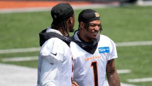 Cincinnati Bengals' Ja'Marr Chase (1) speaks with Tee Higgins during practice at the team's NFL football training facility, Tuesday, June 13, 2023, in Cincinnati. (Jeff Dean/AP Photo)