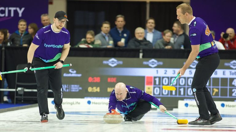 Kevin Koe (centre) delivers a rock as Jacques Gauthier (left) and Karrick Martin (right) prepare to sweep during the Players' Championship on Friday, April 12, 2024, in Toronto. (Anil Mungal/GSOC)