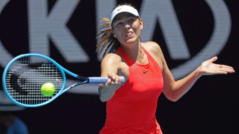 Russia's Maria Sharapova makes a forehand return to Croatia's Donna Vekic during their first round singles match at the Australian Open tennis championship in Melbourne, Australia, Tuesday, Jan. 21, 2020. (Lee Jin-man/AP)