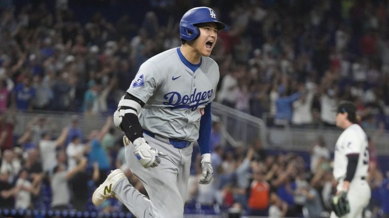 Los Angeles Dodgers' Shohei Ohtani (17) reacts after hitting his 50th home run of the season during the seventh inning of a baseball game against the Miami Marlins, Thursday, Sept. 19, 2024, in Miami. (Marta Lavandier/AP Photo)