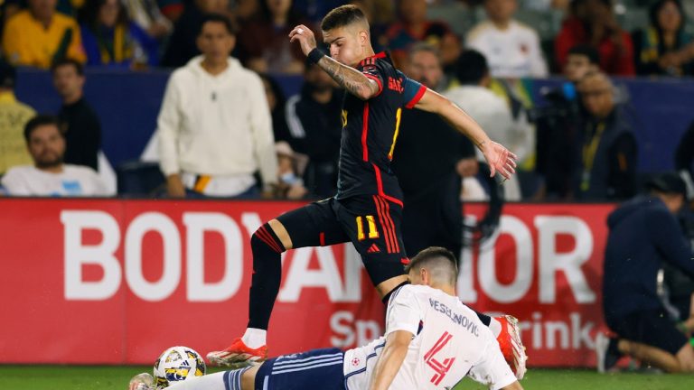 Vancouver Whitecaps’ Ranko Veselinovic (4) tackles Los Angeles Galaxy’s Gabriel Pec (11) during the second half of an MLS soccer match Saturday, Sept. 21, 2024, in Carson, Calif. (Etienne Laurent/AP)