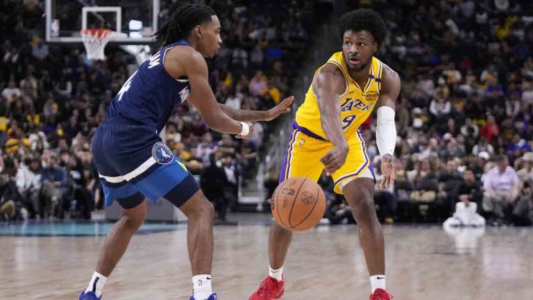 Los Angeles Lakers guard Bronny James, right, passed the ball while under pressure from Minnesota Timberwolves guard Rob Dillingham during the second half of a preseason NBA basketball game, Friday, Oct. 4, 2024, in Palm Desert, Calif. (Mark J. Terrill/AP)
