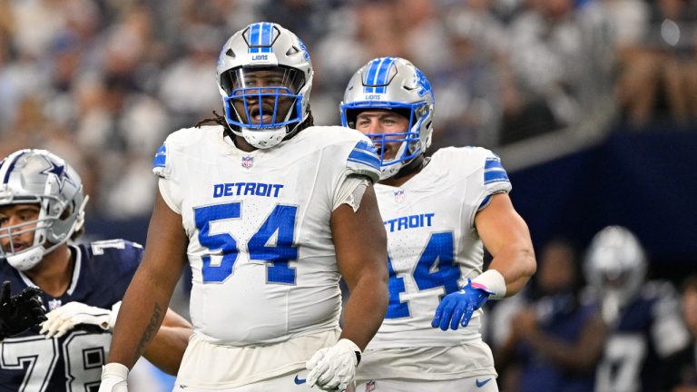 Detroit Lions defensive tackle Alim McNeill (54) and linebacker Malcolm Rodriguez (44) celebrates after McNeill sacks Dallas Cowboys quarterback Dak Prescott for a loss during an NFL football game in Arlington, Texas, Sunday, Oct. 13, 2024. (AP/Jerome Miron)