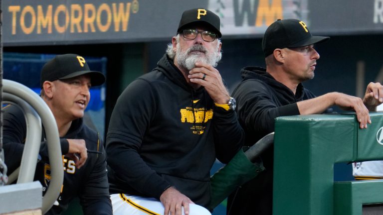 Pittsburgh Pirates manager Derek Shelton, center, bench coach Don Kelly, right, and hitting coach Andy Haines stand in the dugout during the second baseball game of a doubleheader against the Washington Nationals in Pittsburgh, Saturday, Sept. 7, 2024. (Gene J. Puskar/AP)