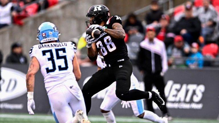 Ottawa Redblacks wide receiver Andre Miller (88) jumps to catch the ball, before scoring a touchdown against the Toronto Argonauts during first half CFL football action in Ottawa on Saturday, Sept. 7, 2024. (CP/Justin Tang)