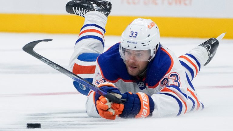 Edmonton Oilers left wing Viktor Arvidsson tries to regain possession while sliding on the ice during the second period of a pre-season NHL game against the Seattle Kraken, Wednesday, Oct. 2, 2024, in Seattle. (Lindsey Wasson/AP)