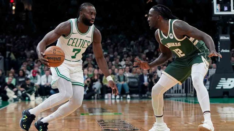 Boston Celtics' Jaylen Brown (7) drives past Milwaukee Bucks' Taurean Prince (12) during the first half of an NBA basketball game, Monday, Oct. 28, 2024, in Boston. (Michael Dwyer/AP)