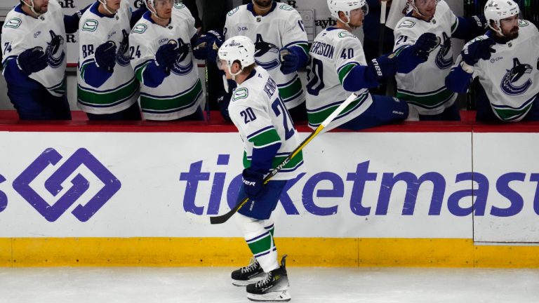 Vancouver Canucks left wing Danton Heinen (20) celebrates with teammates after scoring his second goal during the first period of an NHL hockey game against the Chicago Blackhawks in Chicago, Tuesday, Oct. 22, 2024. (Nam Y. Huh/AP)