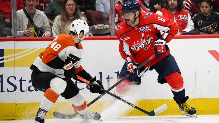 Washington Capitals left wing Alex Ovechkin (8) battles for the puck against Philadelphia Flyers center Morgan Frost (48) during the first period of an NHL hockey game, Wednesday, Oct. 23, 2024, in Washington. (Nick Wass/AP)