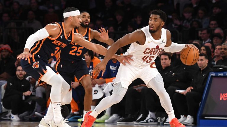 Cleveland Cavaliers' Donovan Mitchell, right, dribbles the ball against New York Knicks' Josh Hart, left, during the first half of an NBA basketball game, Monday, Oct. 28, 2024, in New York. (Pamela Smith/AP)