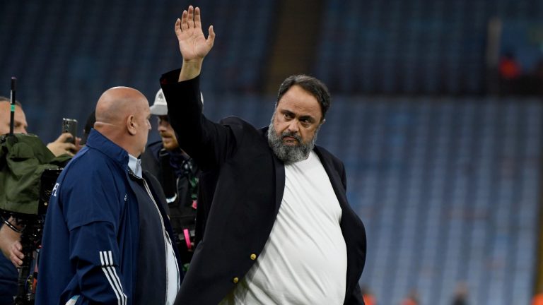 Evangelos Marinakis walks on the pitch at the end of the Europa Conference League semifinal. (AP/Rui Vieira)