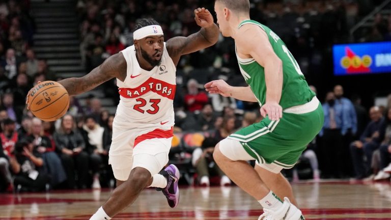 Toronto Raptors guard Jamal Shead (23) tries to get around Boston Celtics guard Payton Pritchard (11). (Nathan Denette/CP)