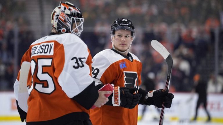 Philadelphia Flyers' Matvei Michkov, right, and Aleksei Kolosov talk during the first period of an NHL hockey game against the Montreal Canadiens, Sunday, Oct. 27, 2024, in Philadelphia. (Matt Slocum/AP Photo)