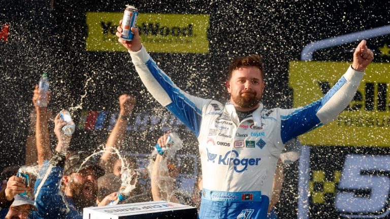 Driver Ricky Stenhouse Jr. celebrates in Victory Lane after a NASCAR Cup Series auto race at Talladega Superspeedway, Sunday, Oct. 6, 2024, in Talladega, Ala. (AP Photo/ Butch Dill)