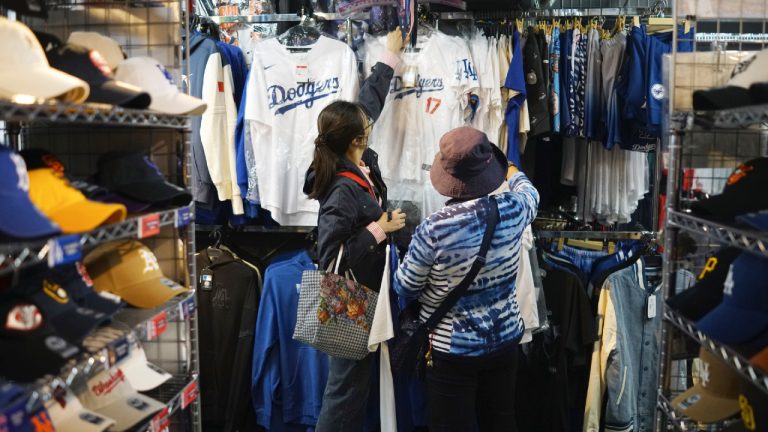 Customers shop around for goods related to Shohei Ohtani of the Los Angeles Dodgers at a sporting goods store, "SELECTION," in Shinjuku district Wednesday, Oct. 23, 2024 in Tokyo. (Eugene Hoshiko/AP)