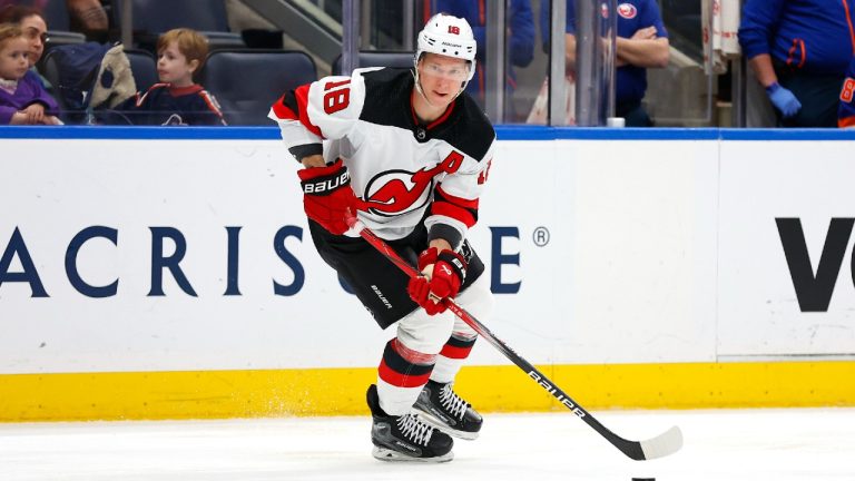 New Jersey Devils left wing Ondrej Palat (18) skates with the puck against the New York Islanders during the third period of an NHL hockey game, Sunday, March 24, 2024, in Elmont, New York. The New Jersey Devils won 4-0. (Noah K. Murray/AP)