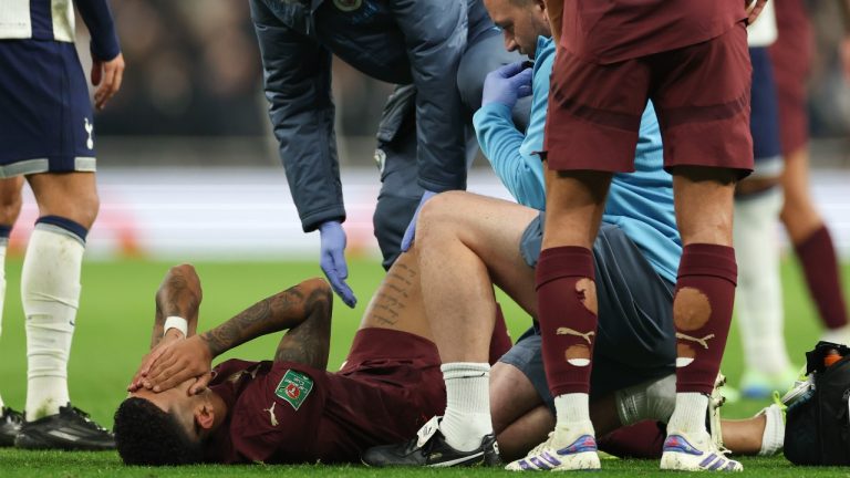 Manchester City's Savinho reacts after sustaining an injury during the English League Cup fourth round soccer match between Tottenham and Manchester City, at the Tottenham Hotspur Stadium in London, Wednesday, Oct 30, 2024. (AP/Ian Walton)