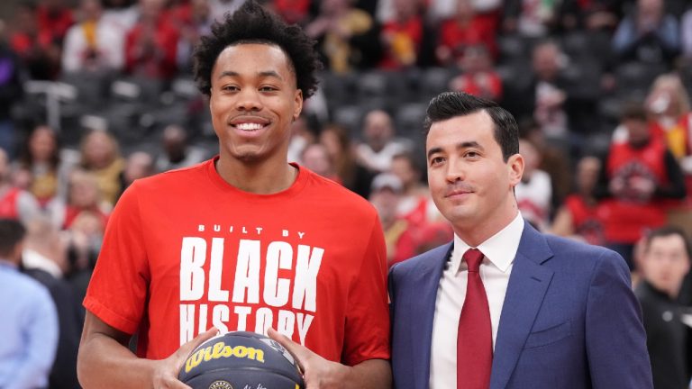Toronto Raptors' Scottie Barnes poses with General Manager Bobby Webster as he is presented with a ball to mark his All Star selection before NBA basketball action against Indiana Pacers in Toronto on Wednesday, February 14, 2024. (Chris Young/CP)