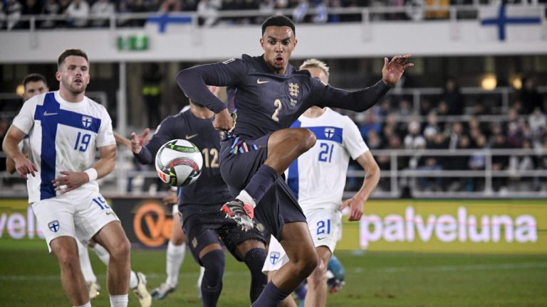 England's Trent Alexander-Arnold, centre, controls the ball during the UEFA Nations League soccer match between Finland and England, at the Olympic Stadium in Helsinki, Finland, Sunday, Oct. 13, 2024. (Markku Ulander/Lehtikuva via AP)