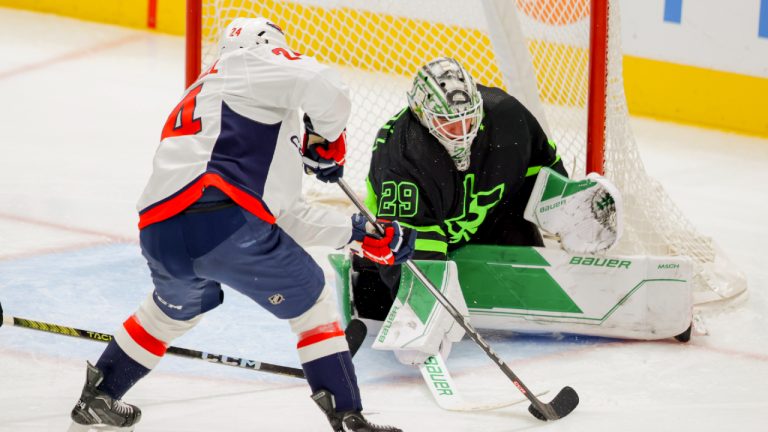 Washington Capitals centre Connor McMichael (24) shoots while Dallas Stars goaltender Jake Oettinger (29) defends during the third period of an NHL hockey game, Saturday, Jan. 27, 2024, in Dallas. (Gareth Patterson/AP)