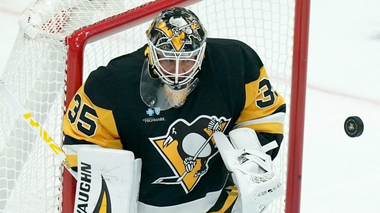 Pittsburgh Penguins goaltender Tristan Jarry (35) deflects a shot during the first period of an NHL hockey game against the New York Rangers, Wednesday, Oct. 9, 2024, in Pittsburgh. (Matt Freed/AP)